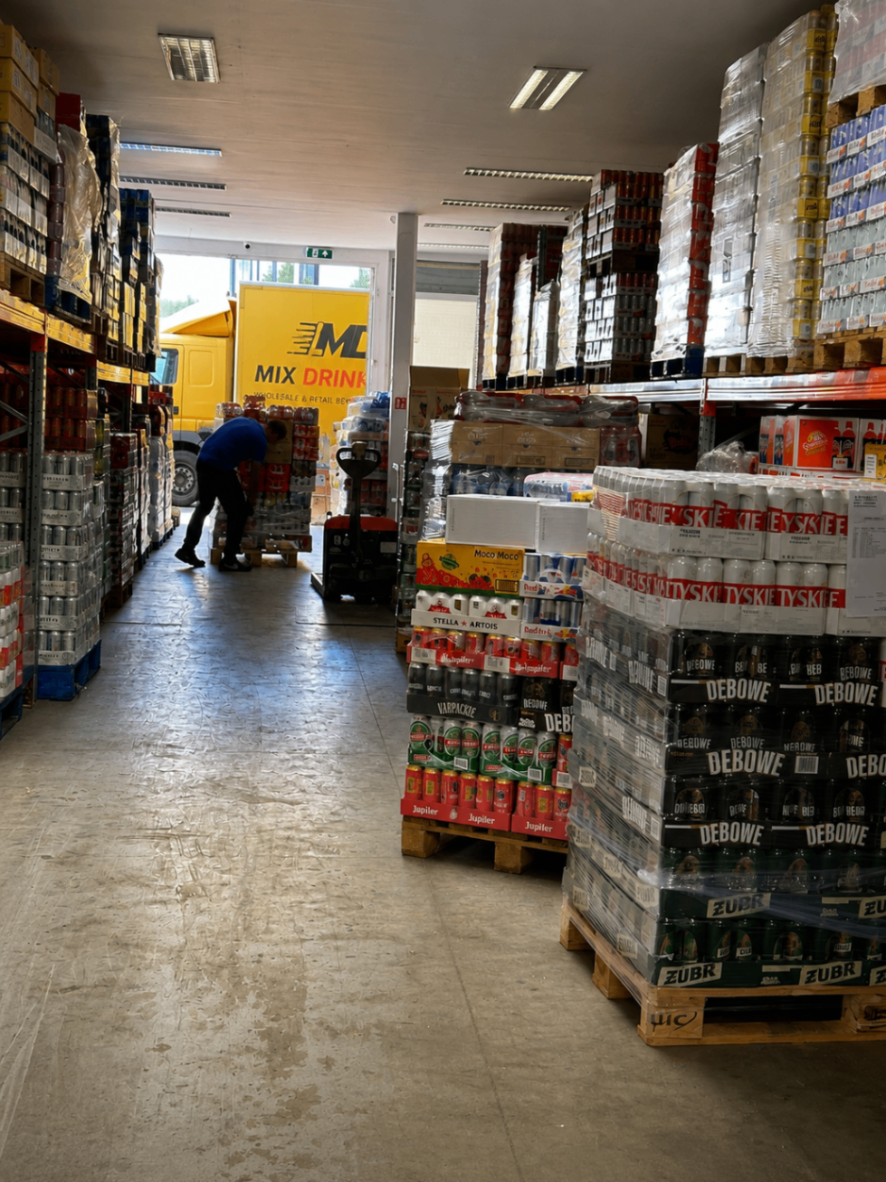 Mix Drink BV warehouse aisle with real stock in Antwerp